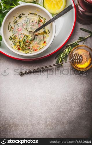 Delicious Marinade , dip or dressing making on gray stone background, top view, place for text
