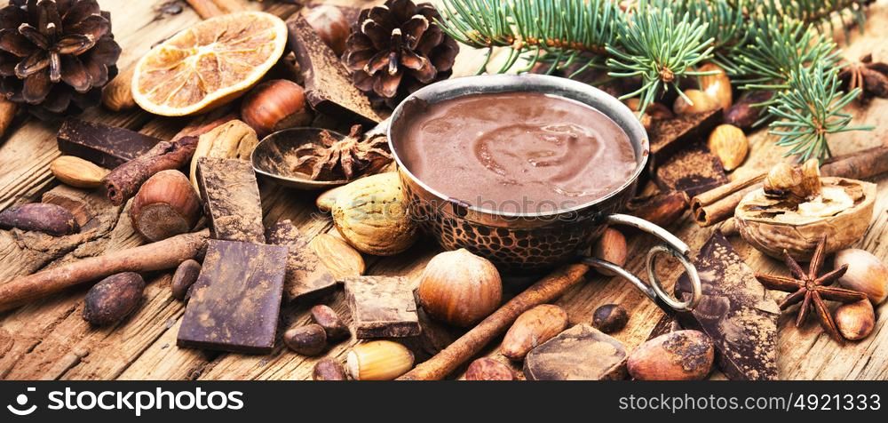 Delicious melted chocolates and spices. Hot melting chocolate with anise,cinnamon sticks,cocoa beans and nuts
