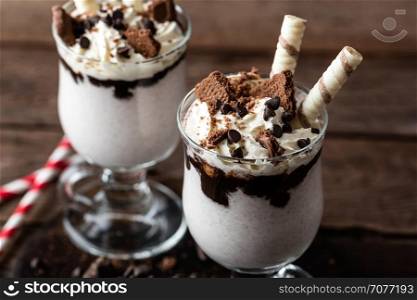delicious milkshake with ice cream, chocolate and cookies
