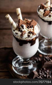 delicious milkshake with ice cream, chocolate and cookies