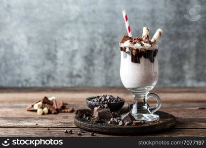 delicious milkshake with ice cream, chocolate and cookies