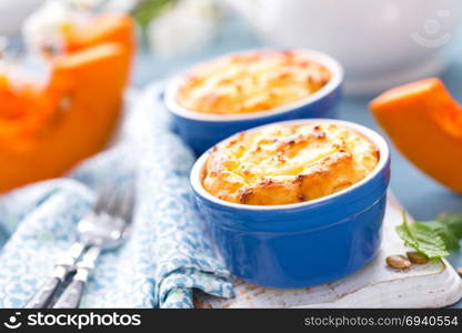 Delicious mini casserole with cottage cheese and pumpkin for breakfast. White background. Closeup