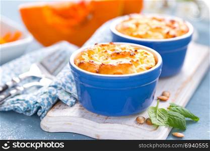 Delicious mini casserole with cottage cheese and pumpkin for breakfast. White background. Closeup