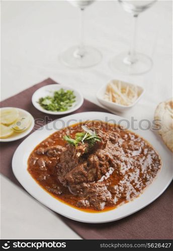 Delicious mutton curry on table