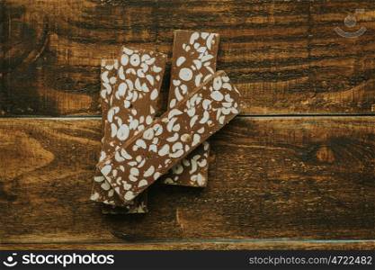 Delicious nougat typical sweet Christmas on a rustic wooden background
