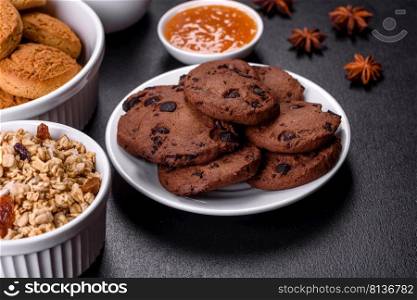 Delicious nutritious healthy breakfast with granola, eggs, oat cookies, milk and jam. Healthy eating at the beginning of the day. Delicious nutritious healthy breakfast with granola, eggs, oat cookies, milk and jam