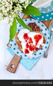 Delicious pancakes on the wooden kitchen table