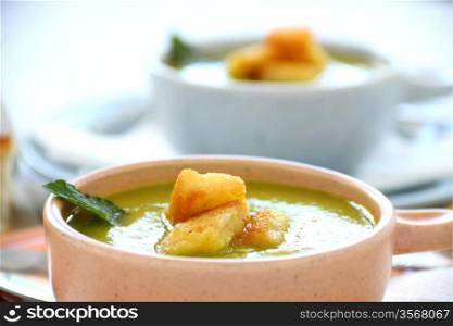 Delicious pea soup with fresh mint ready to serve.