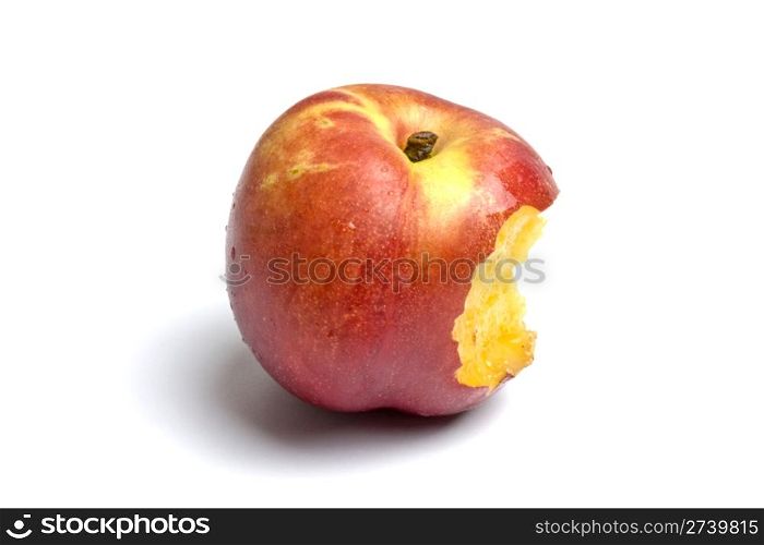 Delicious peach is bited isolated on white background