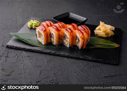 Delicious philadelphia sushi on black stone plate