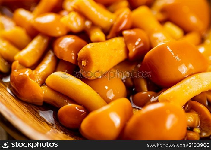 Delicious pickled mushrooms. Macro background. High quality photo. Delicious pickled mushrooms. Macro background.