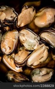 Delicious pickled mussels. Macro background. High quality photo. Delicious pickled mussels. Macro background.