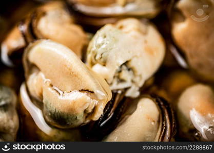 Delicious pickled mussels. Macro background. High quality photo. Delicious pickled mussels. Macro background.