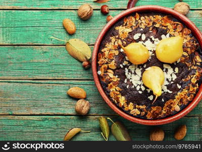 Delicious pie with pear and almonds. Seasonal baked goods. Copy space. Delicious pear pie