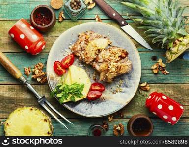 Delicious piece of pork roasted with cheese and pineapple. Pork baked with pineapple