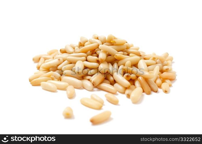 Delicious pine nuts isolated on white