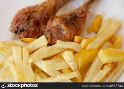 Delicious plate of fries with chicken wings