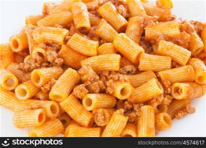 Delicious plate of macaroni served with minced meat and tomato&#xA;