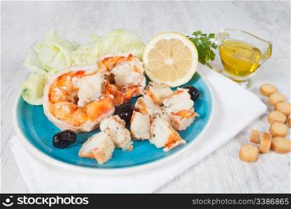 Delicious prawn salad served on a blue plate
