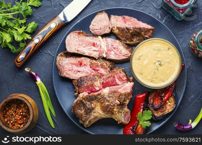 Delicious rare roast beef seasoned with fresh herbs. Beef steak and spices