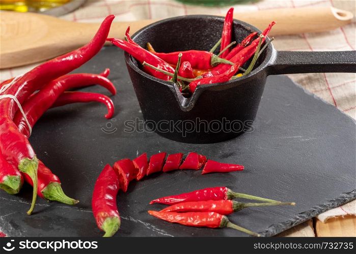 delicious red chili peppers on a slate