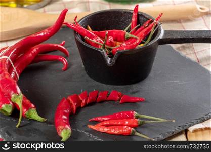delicious red chili peppers on a slate