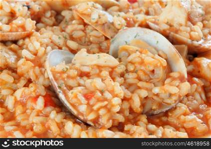 Delicious rice dish with clams sprinkled with parsley