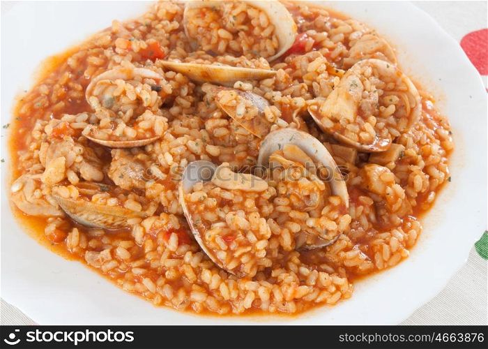 Delicious rice dish with clams sprinkled with parsley&#xA;