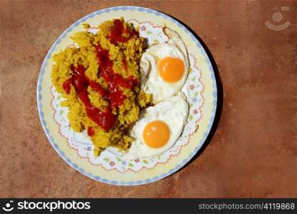 Delicious rice with tomato and two eggs