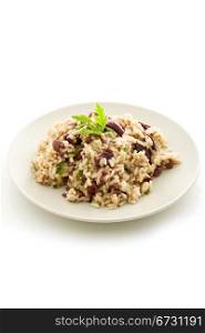 delicious risotto with black olives on white isolated background