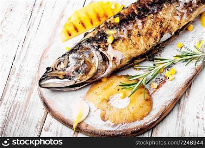 Delicious roasted fish with pineapple.Fishes baked in baking dish. Baked fish with pineapple