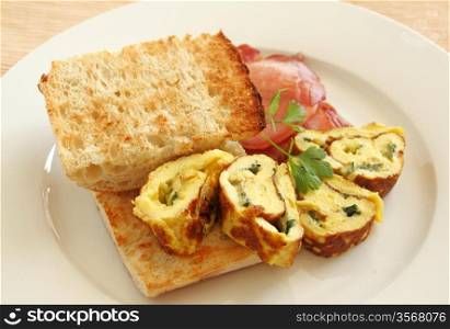 Delicious rolled omelette with bacon and Turkish bread.