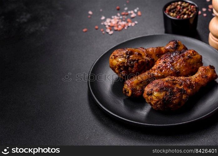 Delicious ruddy grilled chicken legs with spices and herbs. Cooking food over an open fire. Delicious ruddy grilled chicken legs with spices and herbs