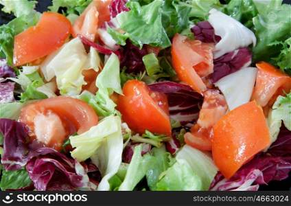 Delicious salad dressed with tomato and lettuce