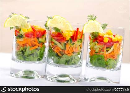 Delicious salad in the glasses