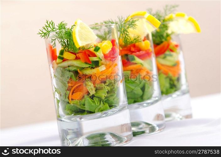 Delicious salad in the glasses