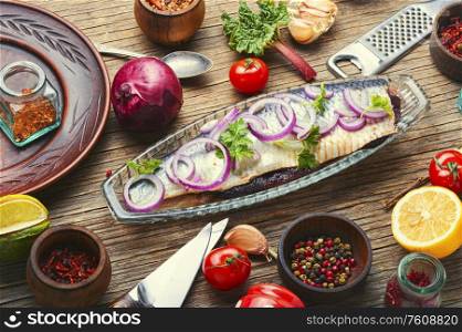 Delicious salted herring with red onion and pepper. Salted herring fish