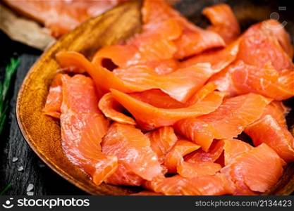 Delicious salted salmon on a plate. Macro background. High quality photo. Delicious salted salmon on a plate.