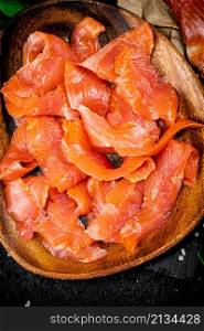 Delicious salted salmon on a plate. Macro background. High quality photo. Delicious salted salmon on a plate.