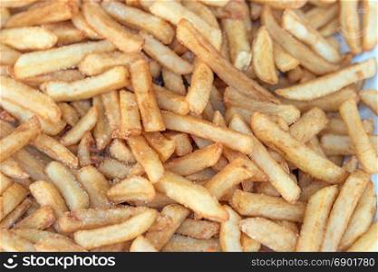 delicious salty french fries on a fair stall, selective focus