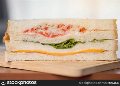 Delicious sandwich bread on a wooden table with blurred background for bakery, food and eating concept