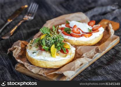 Delicious sandwich of bread,cream cheese vegetable and strawberries