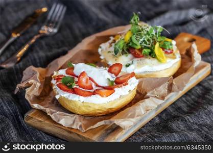 Delicious sandwich of bread,cream cheese vegetable and strawberries