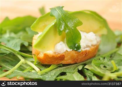 delicious sandwich of toasted bread, avocado and spinach