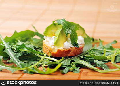 delicious sandwich of toasted bread, avocado and spinach