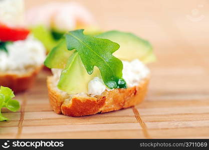 delicious sandwich of toasted bread, avocado and spinach