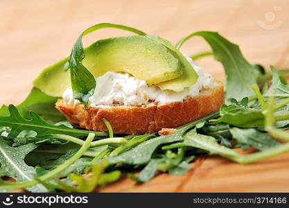 delicious sandwich of toasted bread, avocado and spinach