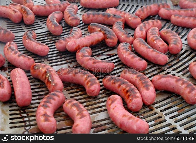 Delicious sausages on the barbecue by becoming