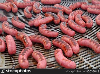 Delicious sausages on the barbecue by becoming