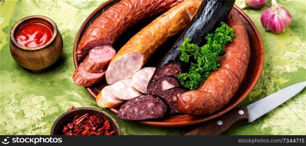 Delicious sausages.Set of smoked meats and sausages. Smoked meats and sausages